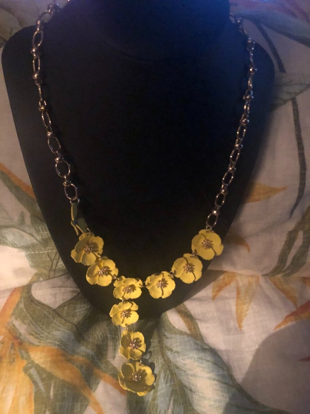 Yellow flower and silver necklace